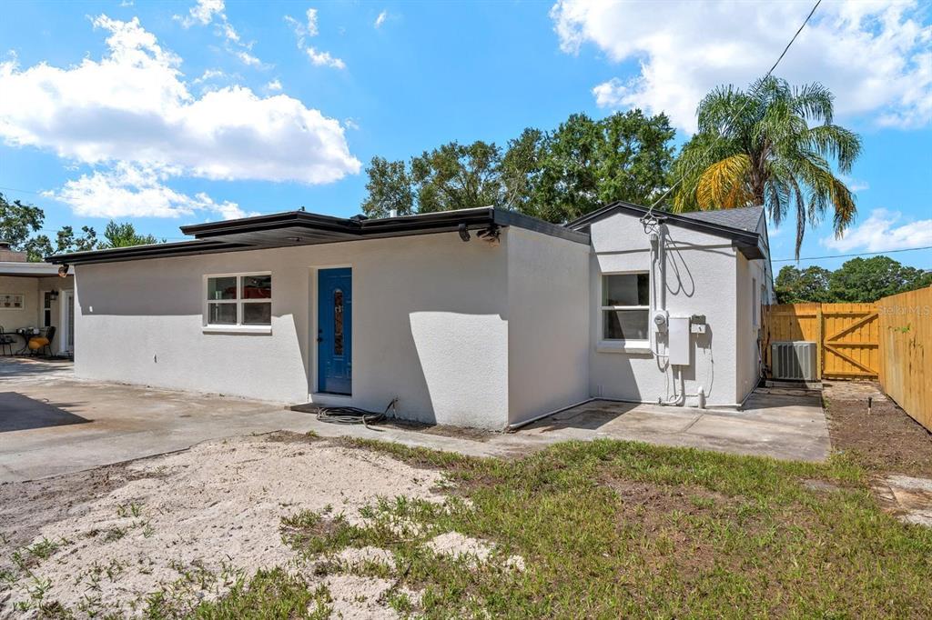 10707 North Rome Avenue Tampa, FL 33612 - Photo 7 of 35 a view of a house with a yard