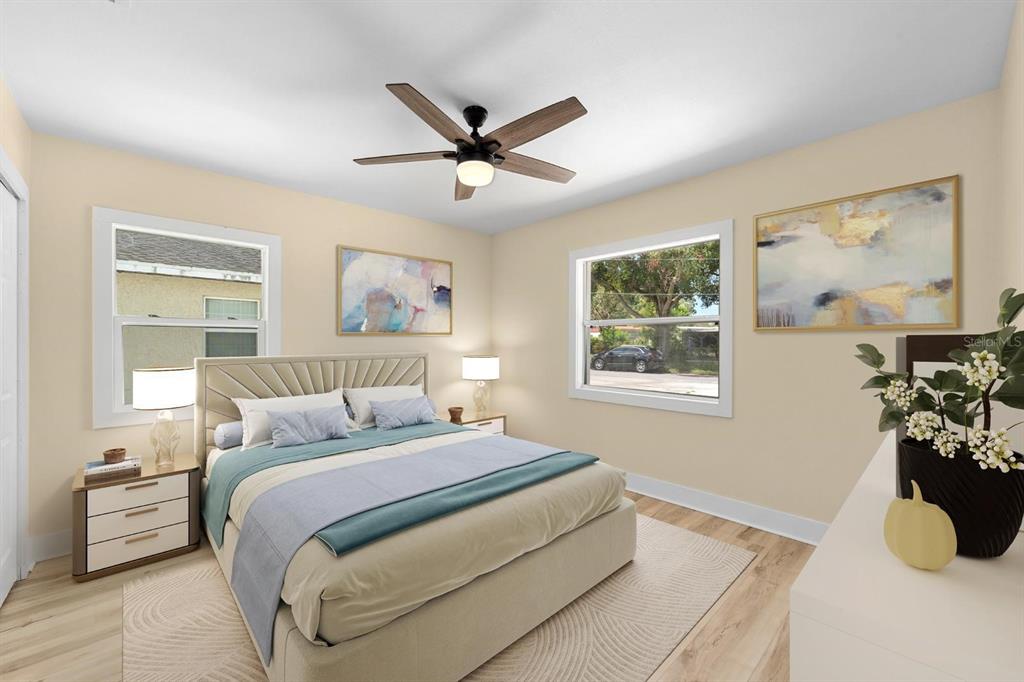 10707 North Rome Avenue Tampa, FL 33612 - Photo 10 of 35 a bedroom with a bed and a chandelier