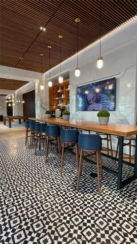 a view of swimming pool with a patio and garden