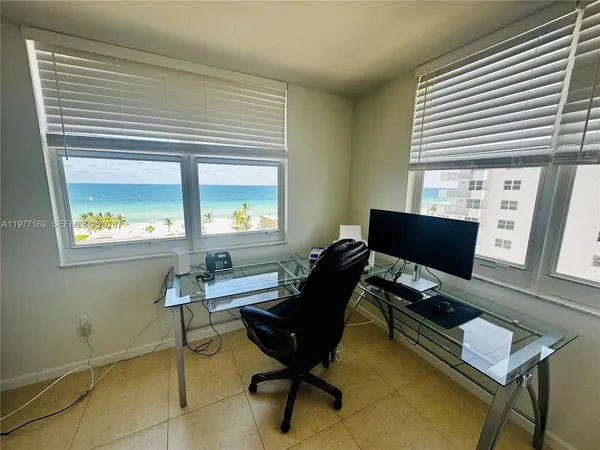 a workspace with furniture and a window