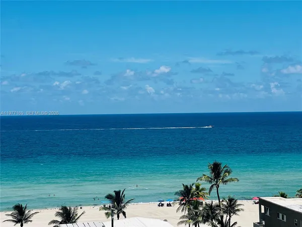 a view of a lake with a yard