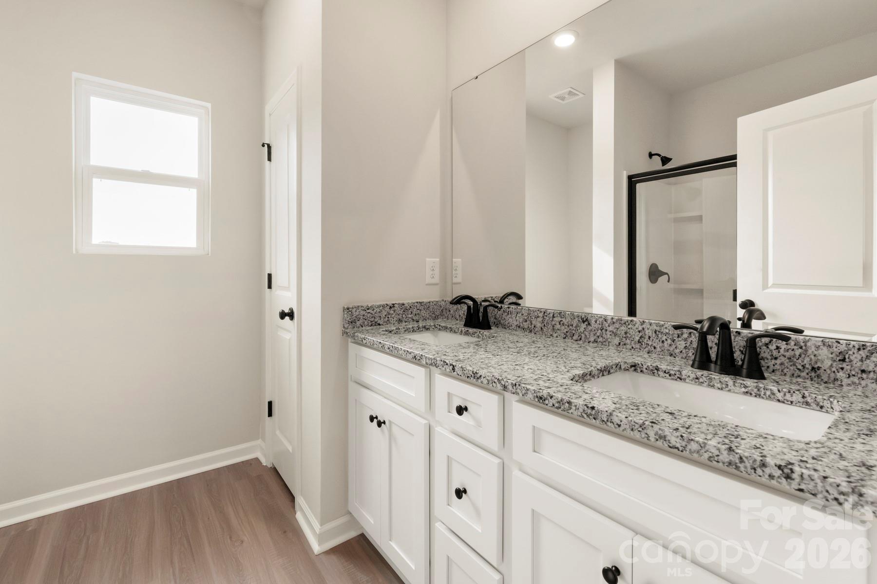 275 Limestone Terrace Salisbury, NC 28146 - Photo 17 of 22 a bathroom with a granite countertop sink and a mirror