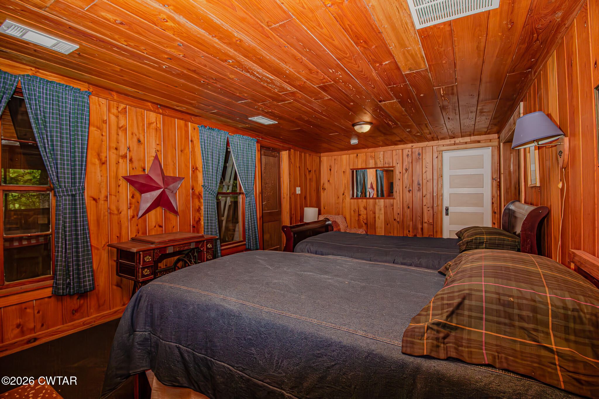 445 Wesley Lake Road Brownsville, TN 38012 - Photo 13 of 21 a bedroom with a bed and wooden floor