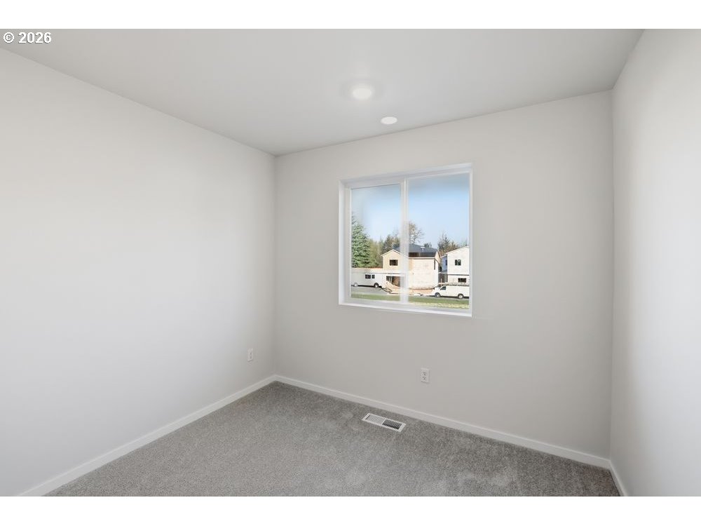 444 Southwest 32nd Street Battle Ground, WA 98604 - Photo 11 of 13 a view of wooden floor in an empty room