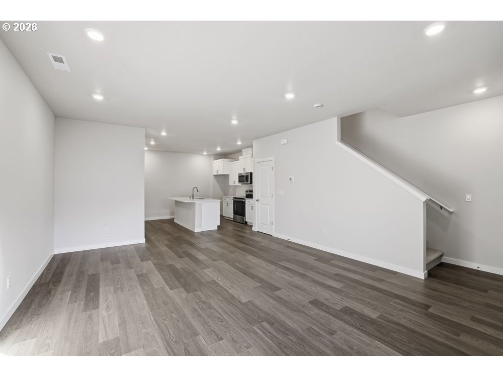444 Southwest 32nd Street Battle Ground, WA 98604 - Photo 4 of 13 a view of empty room with wooden floor
