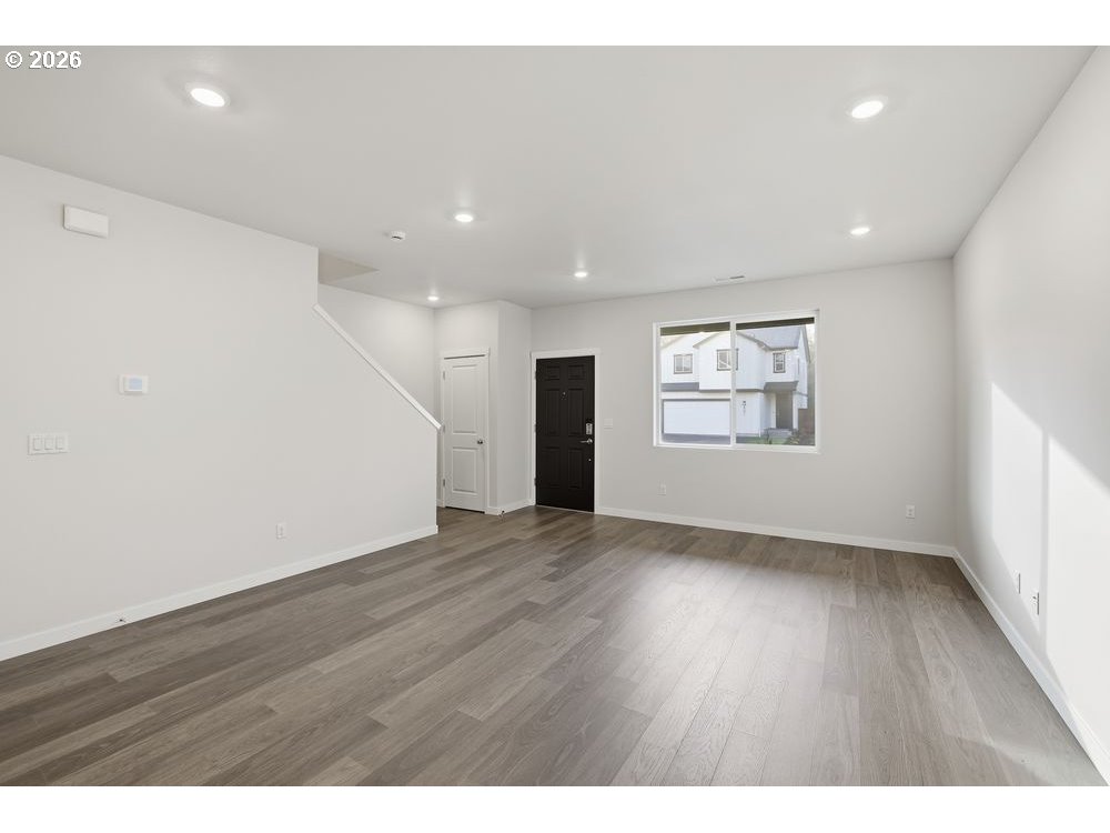 444 Southwest 32nd Street Battle Ground, WA 98604 - Photo 6 of 13 a view of an empty room with wooden floor and a window