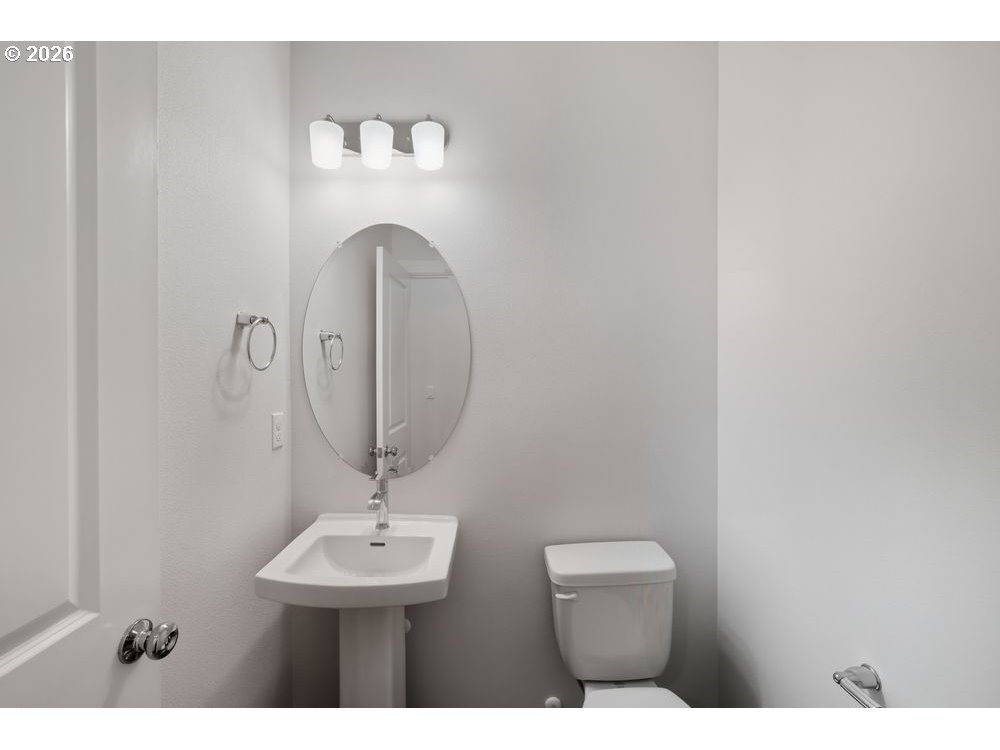 444 Southwest 32nd Street Battle Ground, WA 98604 - Photo 7 of 13 a bathroom with a sink and a mirror