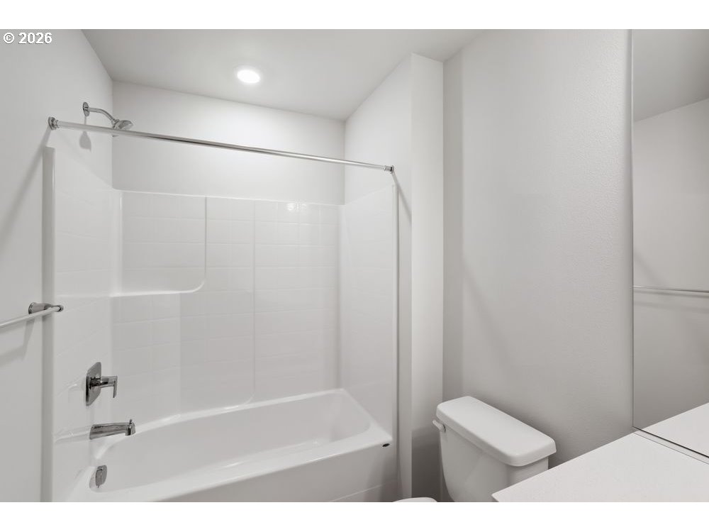 444 Southwest 32nd Street Battle Ground, WA 98604 - Photo 10 of 13 a bathroom with a bathtub and a shower