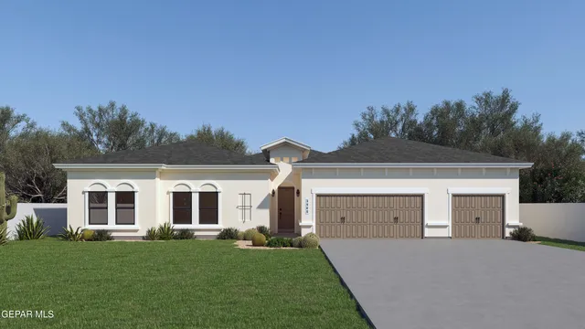 a front view of a house with a garden and yard