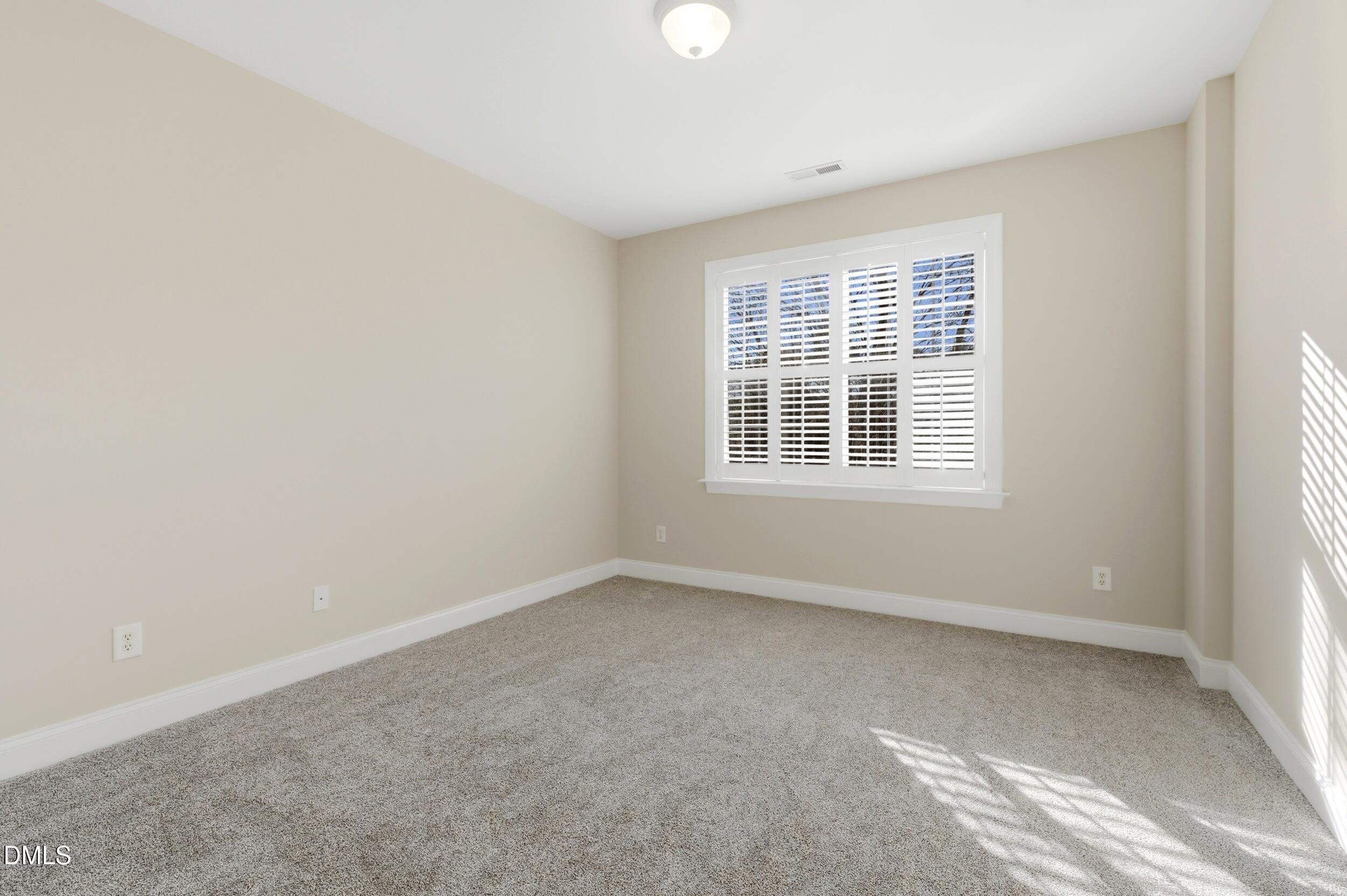 4803 Marena Place Durham, NC 27707 - Photo 24 of 42 a view of an empty room with a window