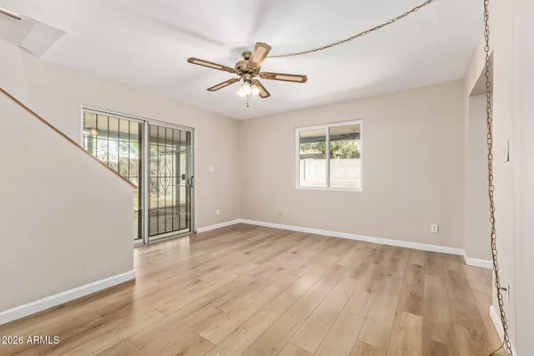 wooden floor in an empty room with a window