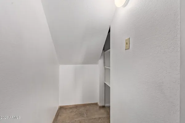 a bathroom with a toilet a sink and shower