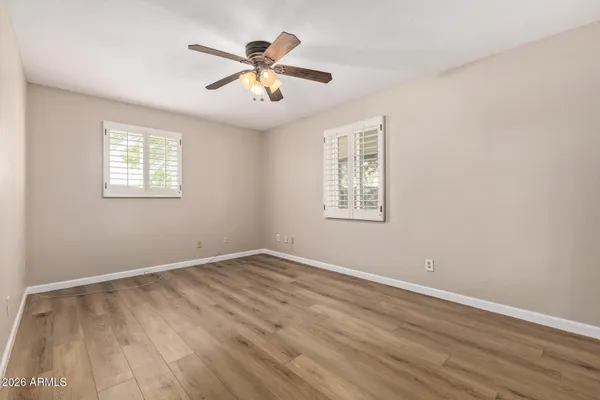 a view of a room with wooden floor and closet