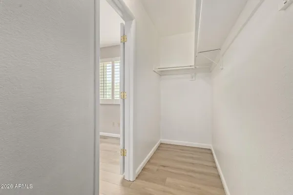 a view of room with wooden floor
