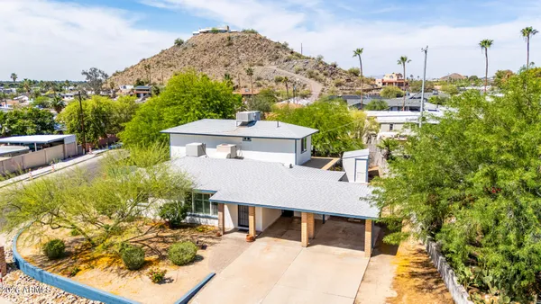 an aerial view of a house with a garden
