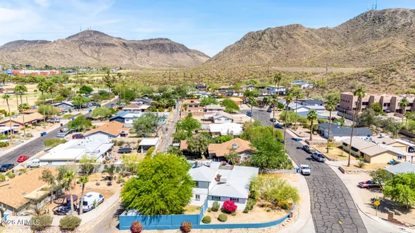 an aerial view of residential houses and outdoor space
