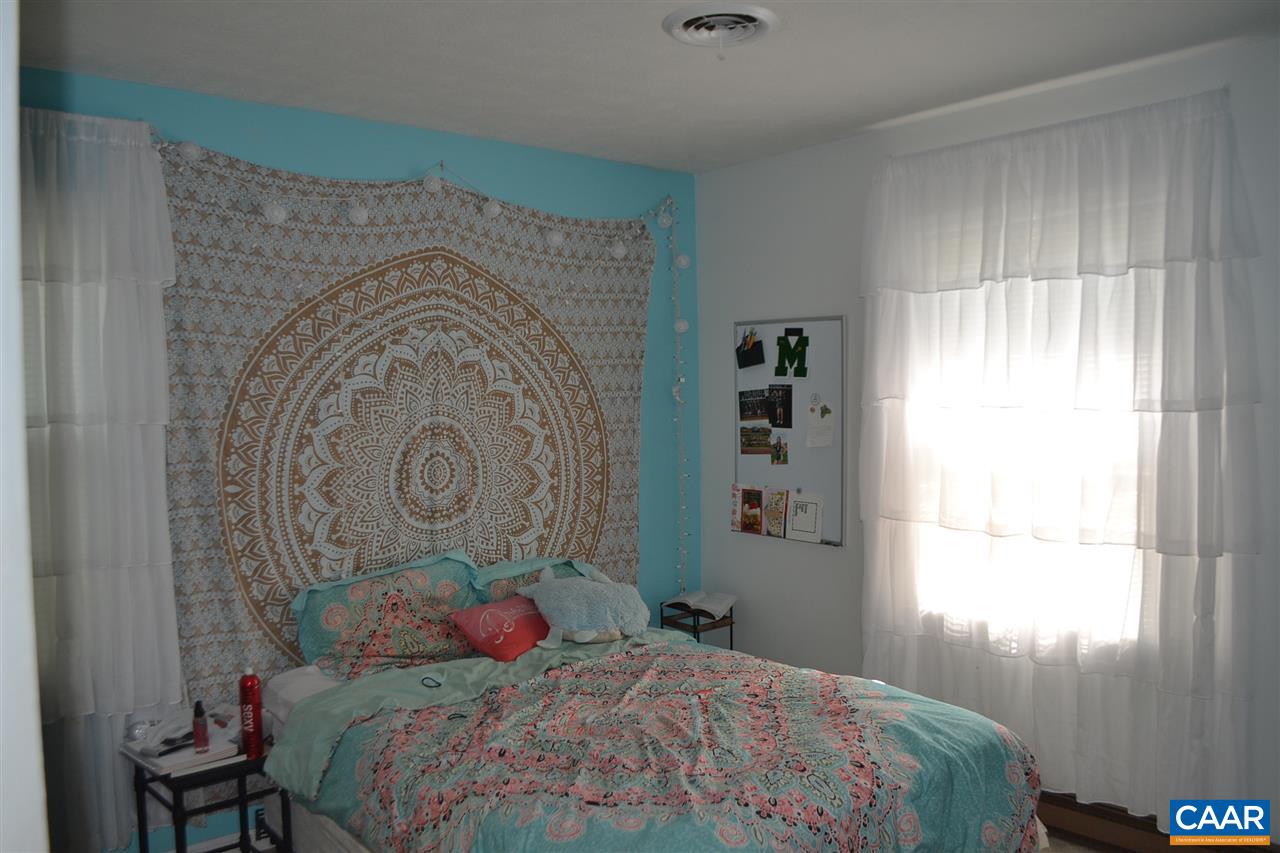 6239 Spring Hill Road Ruckersville, VA 22968 - Photo 18 of 25 a bedroom with a bed and a window
