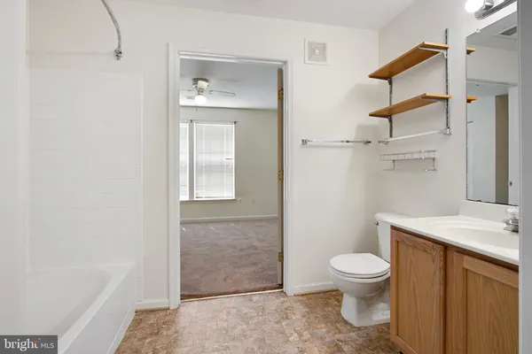 a bathroom with a toilet sink and shower