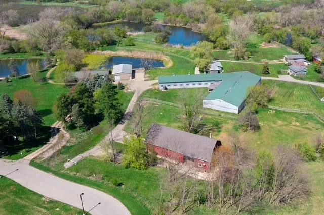 an aerial view of residential house with outdoor space and street view