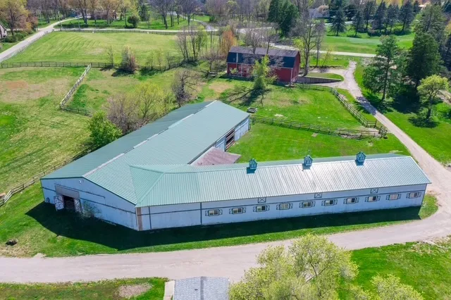 a backyard of a house with wooden floor and lake view