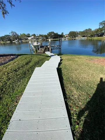 a view of a lake with a yard