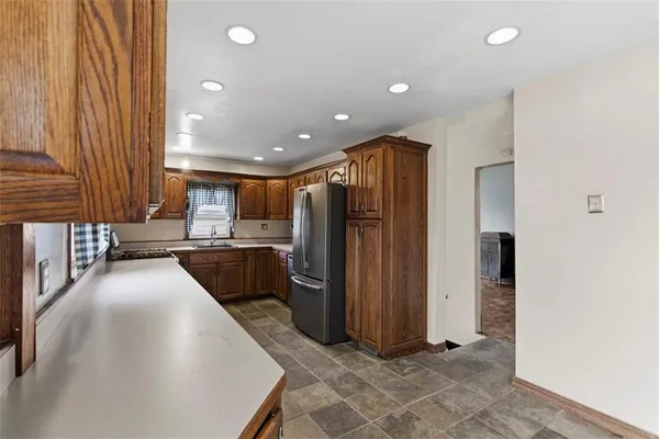 a kitchen with stainless steel appliances granite countertop a stove and a microwave