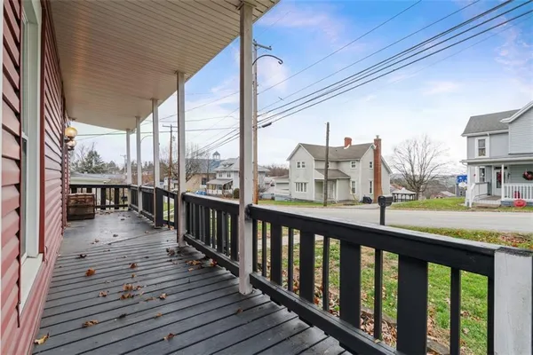 a view of a balcony with wooden floor