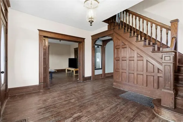 a view of staircase with white walls and stairs