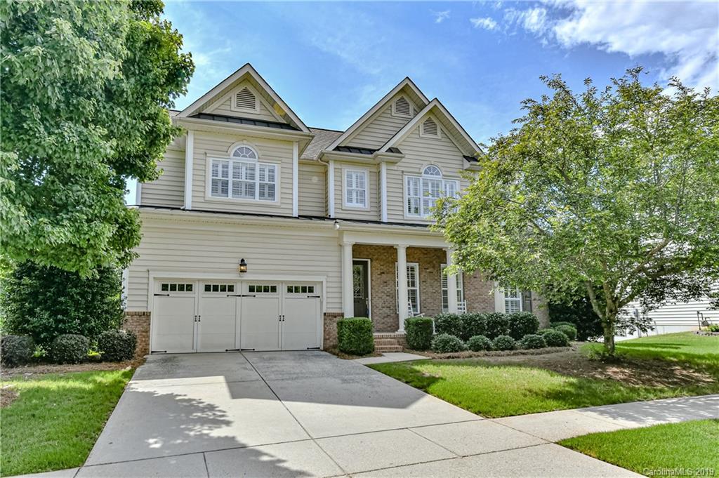 872 Treasure Court Fort Mill, SC 29708 - Photo 1 of 42 a front view of a house with a yard