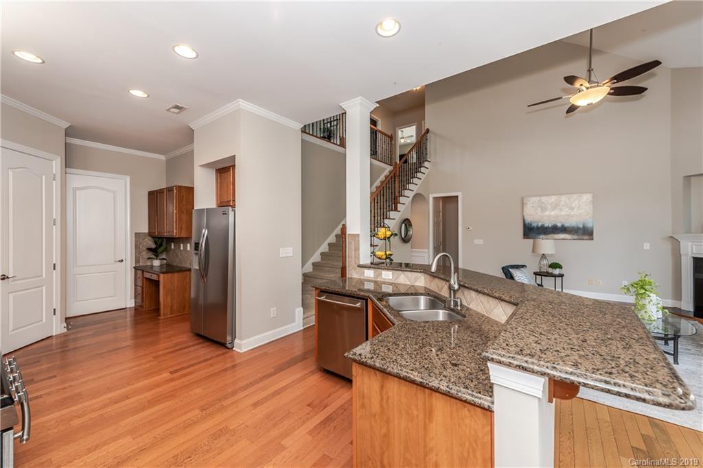 872 Treasure Court Fort Mill, SC 29708 - Photo 14 of 42 a kitchen with stainless steel appliances granite countertop a sink refrigerator and cabinets