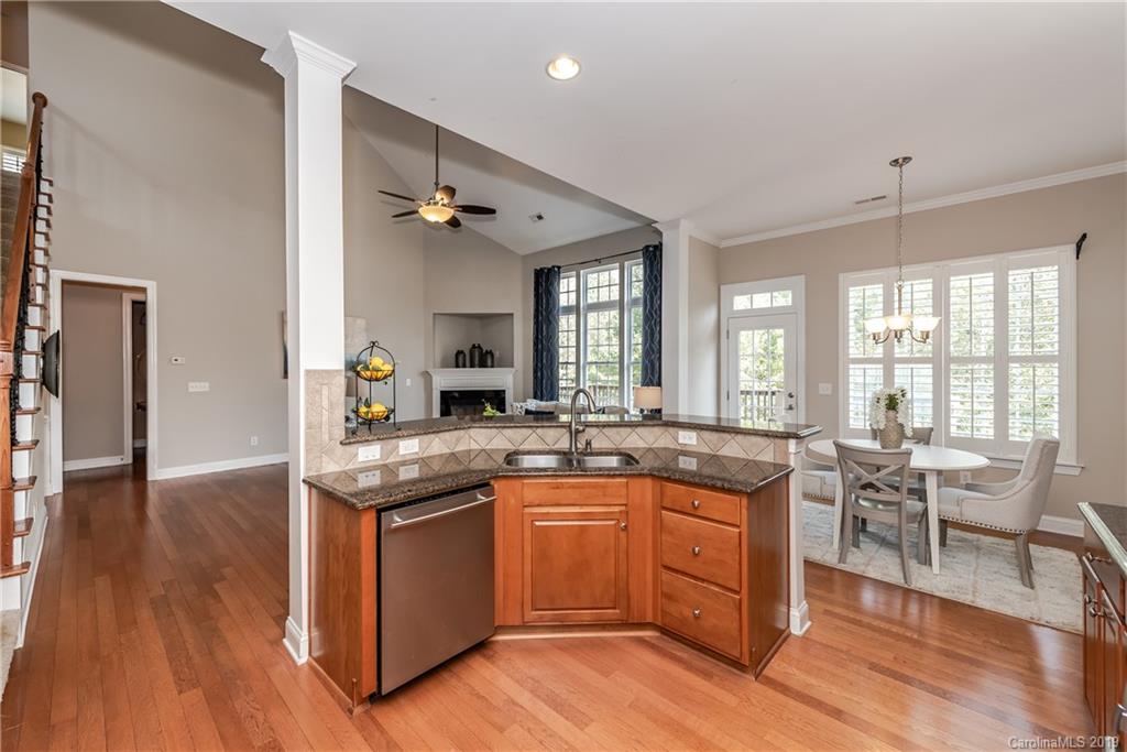 872 Treasure Court Fort Mill, SC 29708 - Photo 15 of 42 a kitchen with a sink cabinets and wooden floor