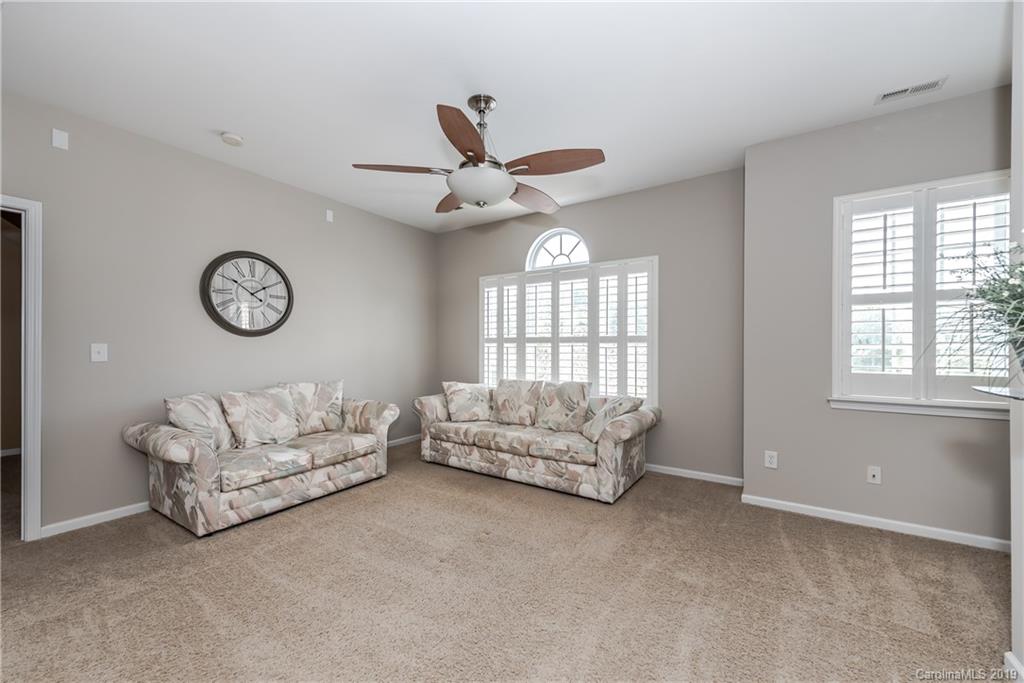 872 Treasure Court Fort Mill, SC 29708 - Photo 22 of 42 a living room with furniture and a large window
