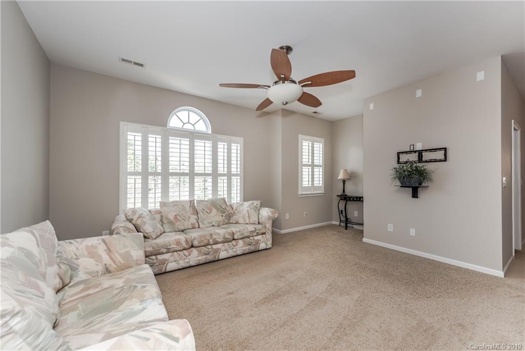 872 Treasure Court Fort Mill, SC 29708 - Photo 23 of 42 a living room with furniture and a large window