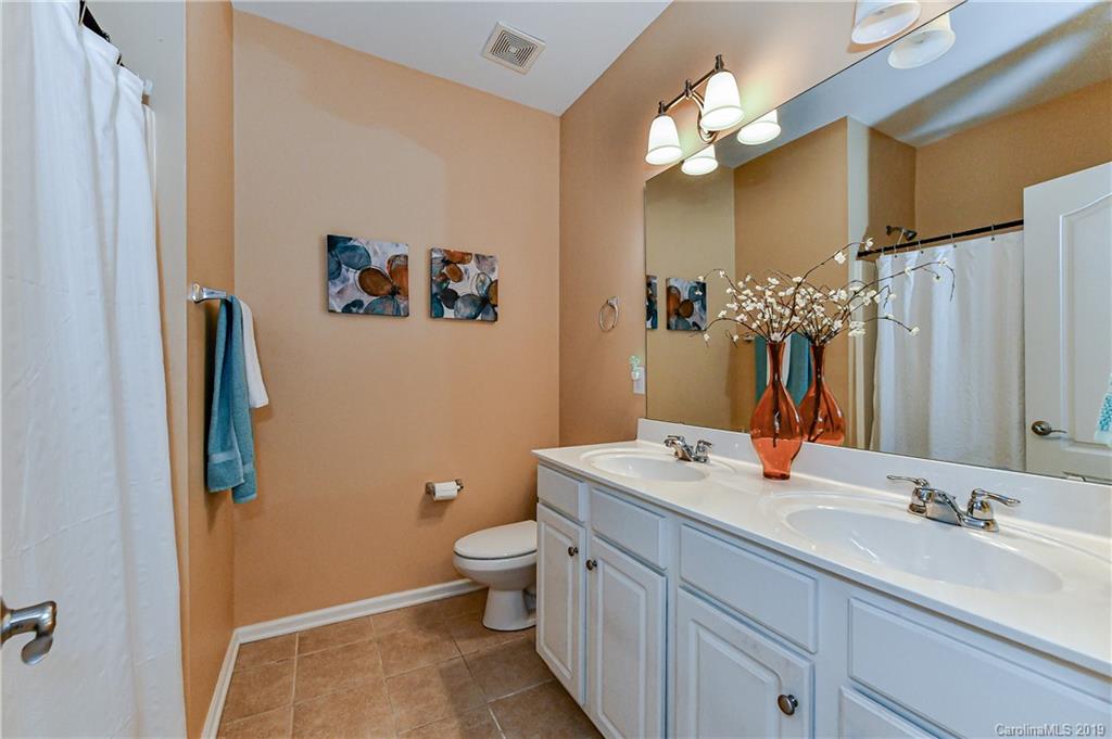 872 Treasure Court Fort Mill, SC 29708 - Photo 26 of 42 a bathroom with a double vanity sink mirror and toilet