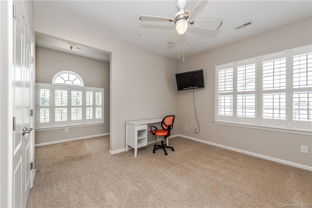 872 Treasure Court Fort Mill, SC 29708 - Photo 27 of 42 a living room with furniture and a flat screen tv