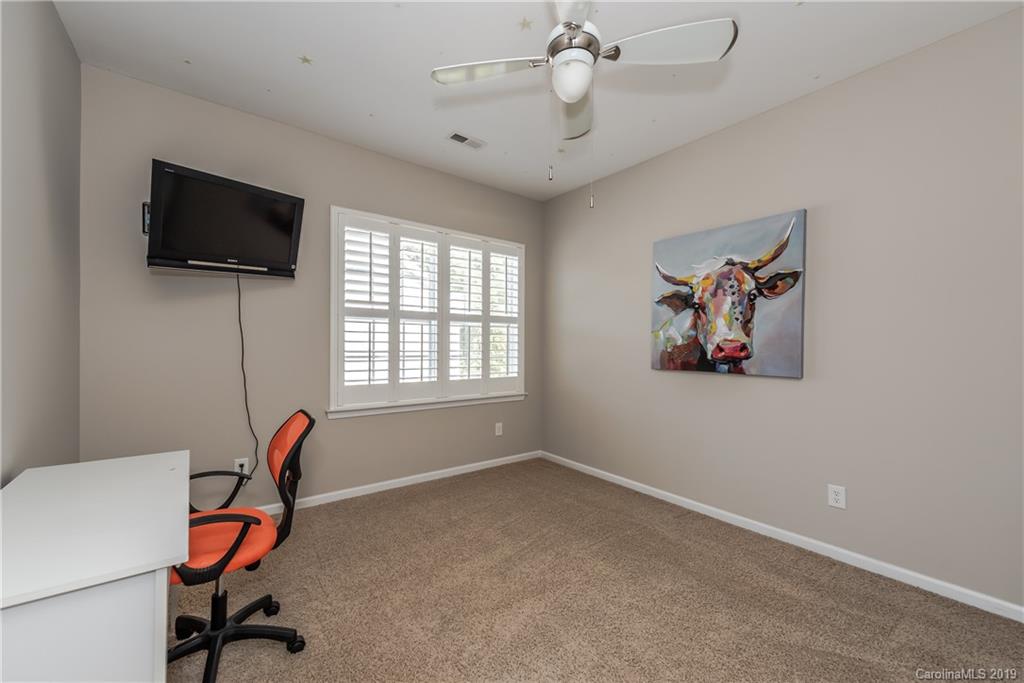 872 Treasure Court Fort Mill, SC 29708 - Photo 28 of 42 a view of a workspace with furniture and a window