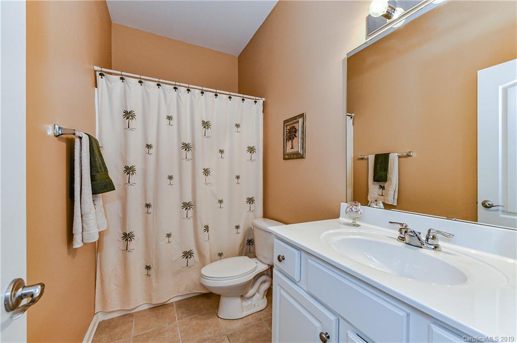 872 Treasure Court Fort Mill, SC 29708 - Photo 36 of 42 a bathroom with a granite countertop sink toilet and shower