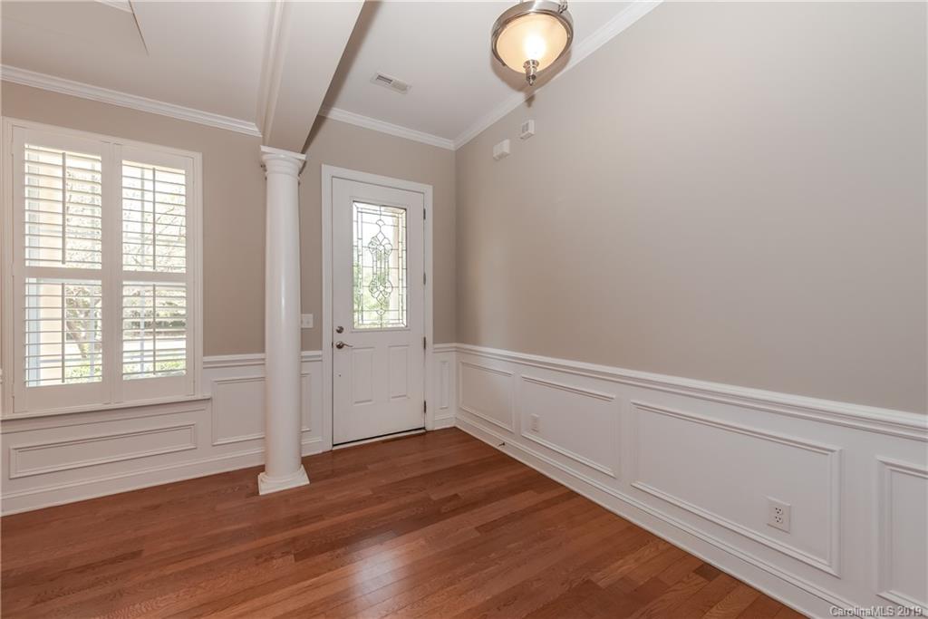 872 Treasure Court Fort Mill, SC 29708 - Photo 6 of 42 a view of an empty room with wooden floor and a window