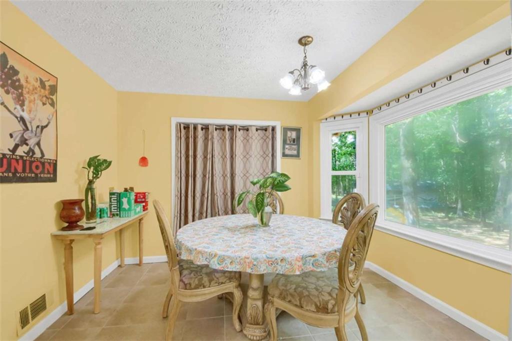 112 Bridget Drive Hampton, GA 30228 - Photo 13 of 26 a view of a dining room with furniture window and outside view