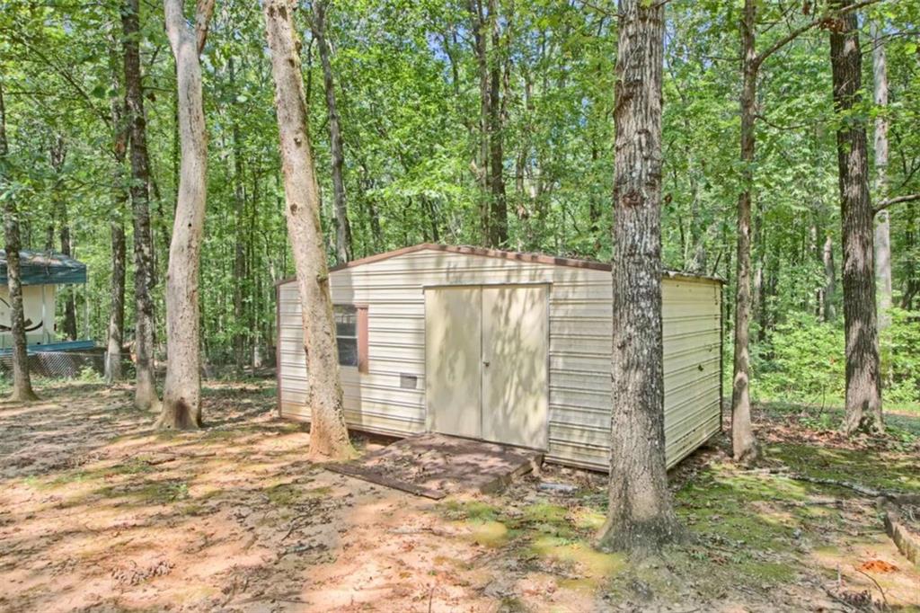 112 Bridget Drive Hampton, GA 30228 - Photo 24 of 26 a backyard of a house with a garden and outdoor seating