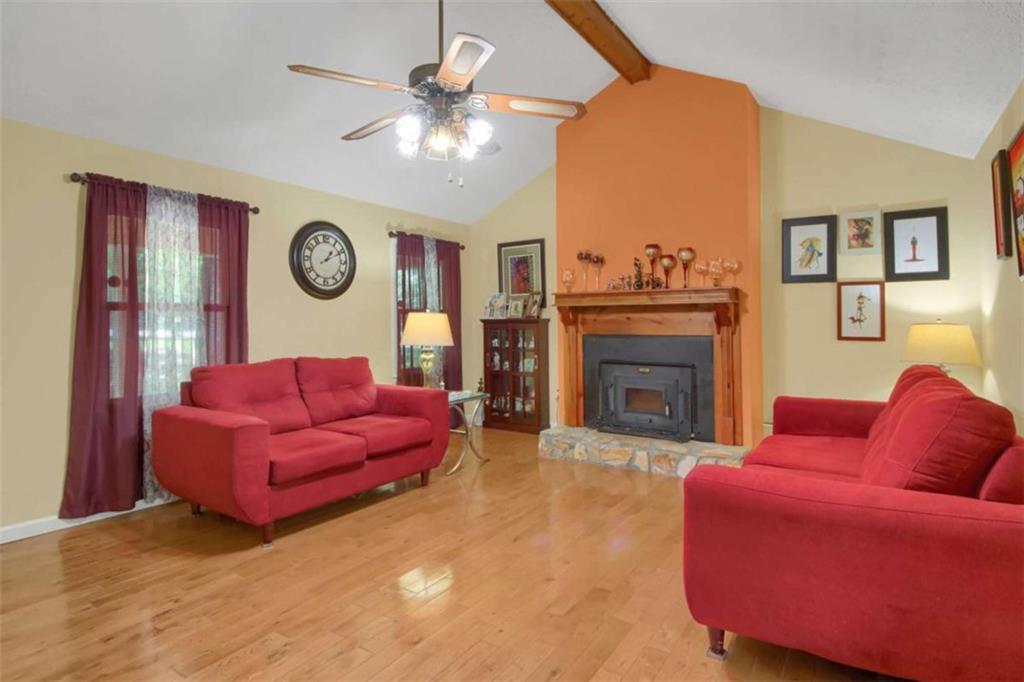 112 Bridget Drive Hampton, GA 30228 - Photo 4 of 26 a living room with furniture and a fireplace