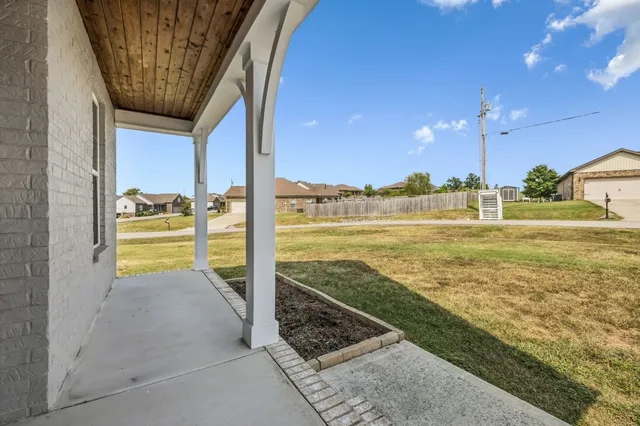 a view of a swimming pool with an outdoor seating