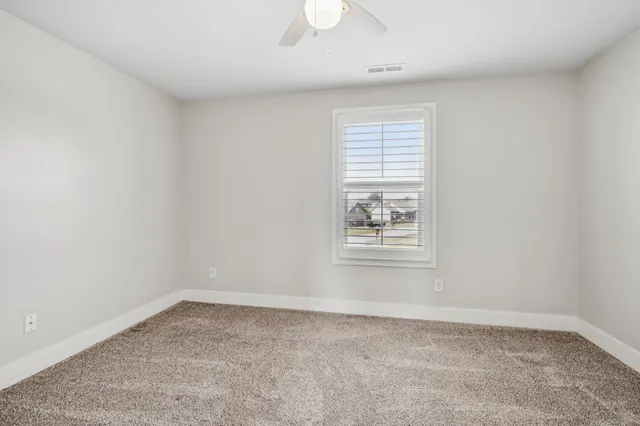 a view of a backyard with sitting area