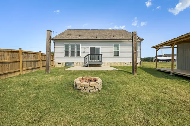 a view of a deck with a big yard