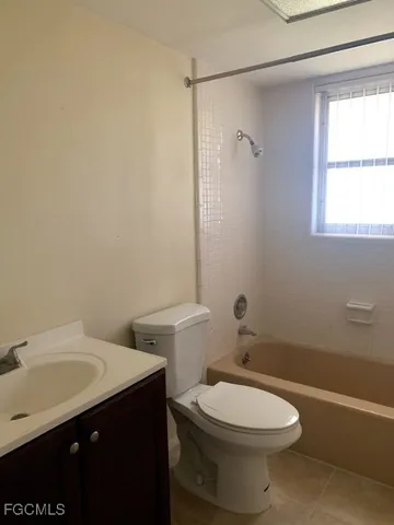a bathroom with a sink a toilet and a bathtub