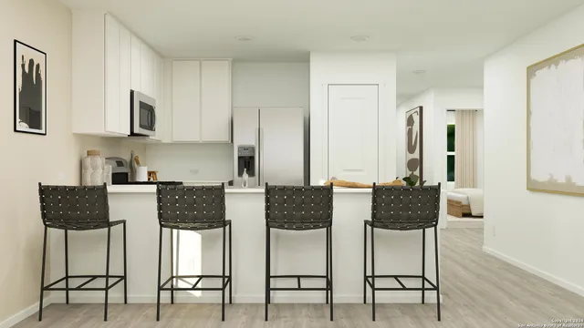 a view of kitchen and dining area with furniture