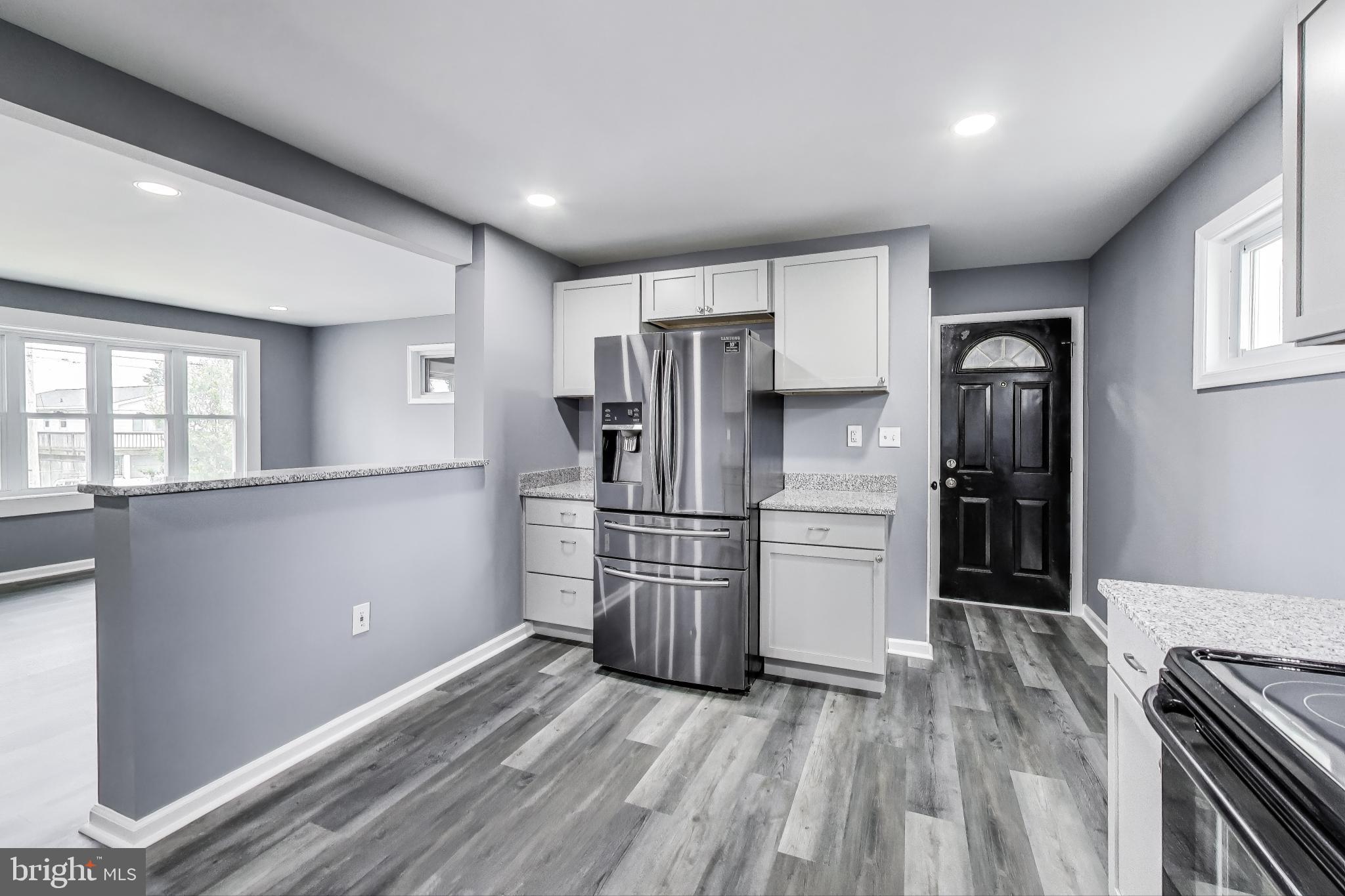 2500 Gehb Avenue Baltimore, MD 21227 - Photo 14 of 53 a kitchen with a refrigerator and a sink