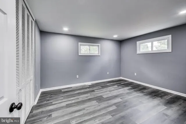 a bathroom with a sink a toilet a shower and a mirror