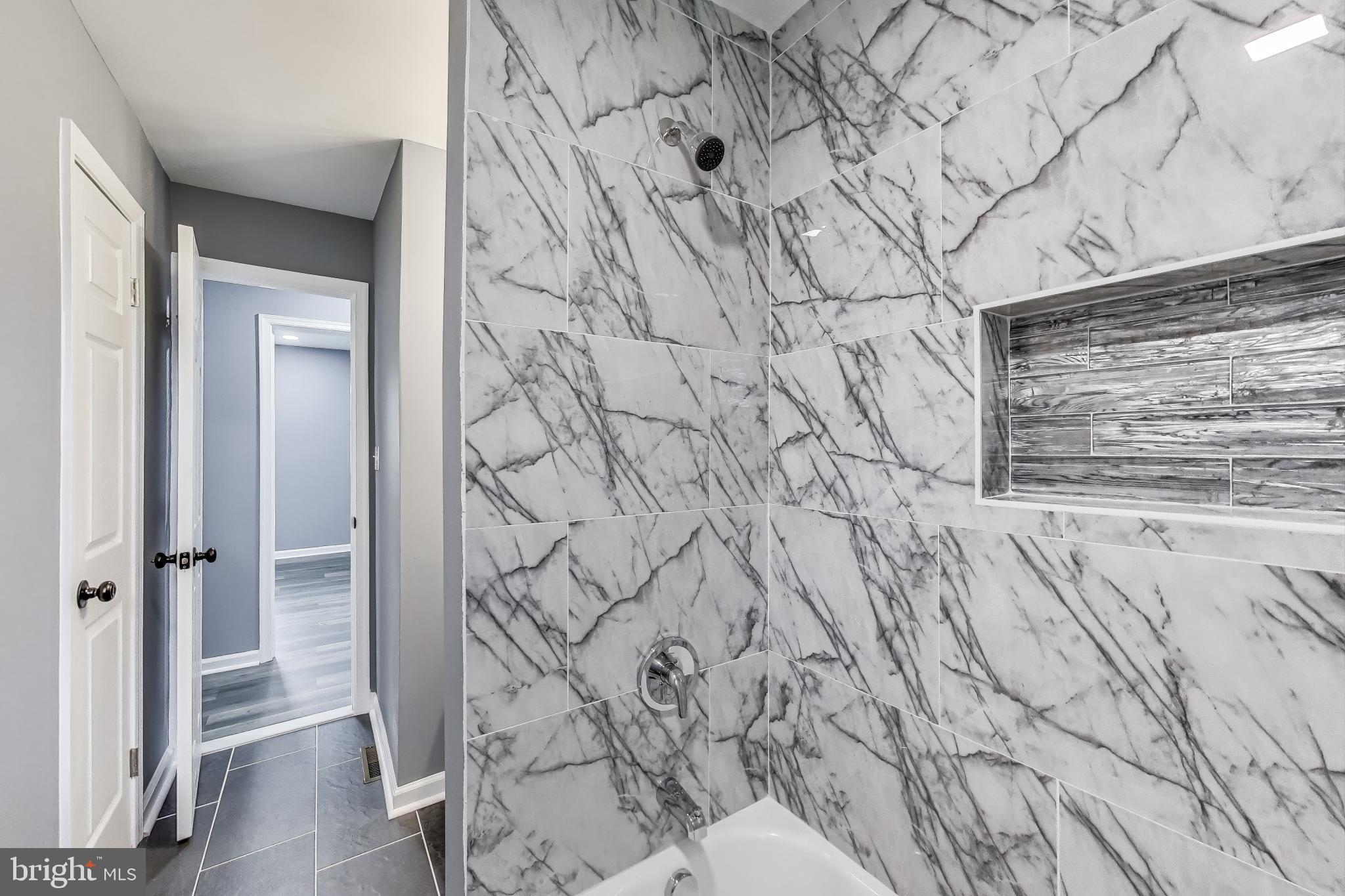 2500 Gehb Avenue Baltimore, MD 21227 - Photo 26 of 53 a bathroom with a bathtub and shower