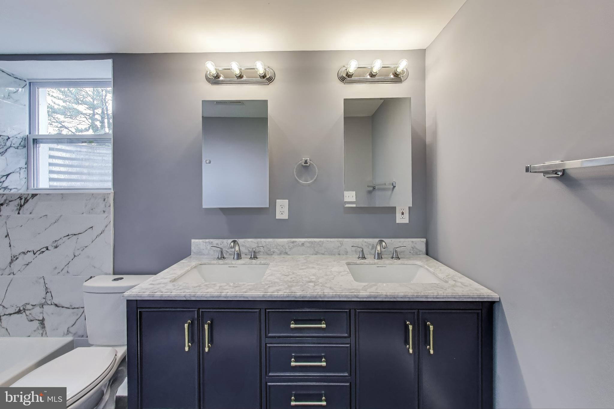 2500 Gehb Avenue Baltimore, MD 21227 - Photo 41 of 53 a bathroom with a sink and a mirror